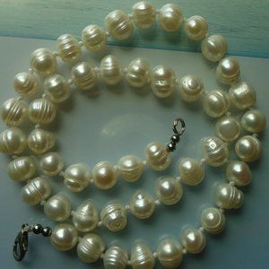 Genuine pearl beaded individually knotted necklace.